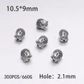 Macro shot of 300 pieces silver Buddha head alloy beads for DIY jewelry making - 300PCS/Pack / Silver Big Ear Buddha