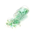 Irregular iridescent green glitter flakes spilling from a 15ml clear glass bottle - Green