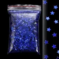 Dettaglio di paillettes blu a forma di stella in una busta di plastica trasparente - Paillettes a Stella Blu