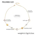 Detail view of 18k gold plated necklace with white cat's eye stones and imitation pearls - Gold White