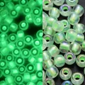 Luminous 3mm glass beads with AB coating showing glow-in-the-dark green effect - Iridescent Style / 3mm, 600 Pcs/Pack / Fruit Green