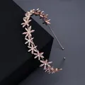 Rose gold bridal headband featuring sparkling rhinestone flower design on black display box - Rose Gold