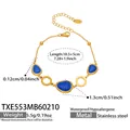 Edelstahlarmband mit 18k Vergoldung und drei ovalen blauen Katzenaugen-Steinen - Armband / 18.5+5cm / Königsblau