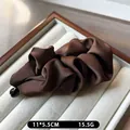 Coffee brown satin pleated banana hair clip with silk texture and black bead detail - Brown