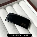 Elegant black rectangle hair clip with gold France Handmade logo on white velvet - Black