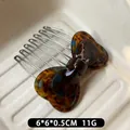 Retro amber leopard pattern acetate bow hair comb with silver metal teeth for women - Blue Coffee