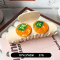 Pince à cheveux en acétate crème avec accents orange et détail fleur verte - Kaki