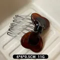 Brown tortoise shell acetate bow hair comb with silver metal teeth for elegant styling - Caramel color