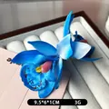 Pince à cheveux fleur d'orchidée bleue bohème pour vacances avec textures réalistes - Bleu