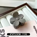 Matte grey flower-shaped hair claw clip, measures 4x4x3.5cm and weighs 7.5g - Dark Gray