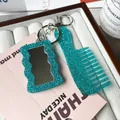 Teal glitter acrylic keychain set with a small wave mirror and a portable mini comb - Green
