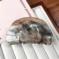 Brown marble pattern acetate hair claw clip with semi-round shape on white velvet - Gradient Gray