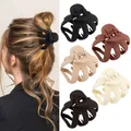Matte finish octopus hair claw clips in five neutral colors shown in use and product display - Earth Tone Matte Hair Claws