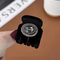 Mini-Haarklammer in Schwarz mit grauem Kristall und glitzerndem Strassstein-Rand-Detail - Runder Strass
