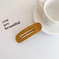 Fermaglio per capelli opaco giallo zenzero con design ovale cavo minimalista - Stile Giallo