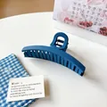 Matte Klein blue large hair claw clip in minimalist geometric twisted design - Deep Blue Large Round