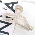 Pinza per capelli a fiocco tortora traslucido con molla in metallo dorato chic - Grigio