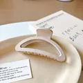 Matte cream-colored semicircular hair claw clip with frosted texture in a lifestyle scene - Moon Style (5#) / Light Coffee