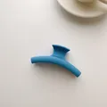 Minimalist sky blue matte hair claw clip with a sleek curved geometric design - Light Blue Basic