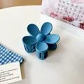 Matte blue flower hair claw clip with minimalist five-petal design for daily styling - Light Blue Floral