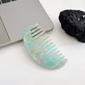 Semicircle acetate hair comb featuring green and white marble texture in a minimalist style - Cyan