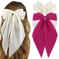 Detail of oversized satin bow hair clips in beige and rose pink with long trailing ribbons - Milk White And Rose Red Style (Set 6)
