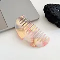 Pink and orange marble acetate wide-tooth hair comb in a modern crescent shape - Sakura Pink