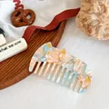 Pink and blue marble texture acetate hair comb in a cute cat shape with gold details - Floral Orange