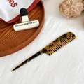 Detailed view of tortoiseshell acetate sectioning comb with fine teeth and long handle - Dark Tortoiseshell