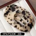 Pince à cheveux en acétate beige à taches léopard avec logo H doré sur coffret luxe - Léopard Clair