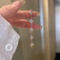 Detailed view of 18k gold plated four-leaf clover bracelet with turquoise zircons - Gold