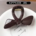 Molla per capelli a fiocco caffè scuro in resina lucida lunghezza 9,5 cm - Cioccolato