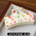 Creamy Christmas hair claw clip with colorful gingerbread man and tree prints - Gift