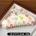 Creamy white 10.5cm Christmas hair claw clip with gingerbread man and festive patterns - Gift