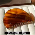 French tortoise shell acetate hair claw clip with Barrette La France gold lettering - Caramel color