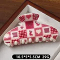 Red and white checkered Christmas hair claw clip with heart and snowflake patterns - Button