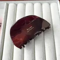 Pince à cheveux élégante en acétate ambre avec inscription Barrette La France dorée - Chocolat