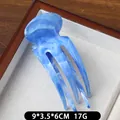 Pince à cheveux bleue motif marbre en plastique, dimensions 9x3,5x6cm pour femme - Bleu