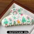 White Christmas claw clip with colorful holiday patterns like trees and bells - White Tree