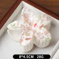 Pince à cheveux de Noël avec motifs bonhomme de neige sur base crème, taille 8x4,5cm - Motif Gants Bruns