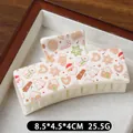 Creamy white Christmas hair claw clip with festive Santa and snowman printed patterns - Brown Gloves Pattern