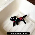 Cute black leopard cat hair clip with red bow and gemstone detail, 6x4x0.5cm size - Black Side Clip