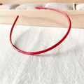 Close-up of red candy-colored headband featuring non-slip inner teeth for hair styling - Rose Red