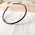 Minimalist black slim headband with anti-slip inner teeth for women's hair styling - Black