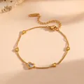 Close-up of gold-plated titanium steel bracelet featuring crystal-inlaid heart charms. - Double Solid Rhinestone Heart Style (N213)