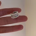 Detailed macro view of a French vintage ear cuff featuring rows of pearls and clear zircons - Single Ear Cuff / Silver