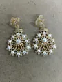 Elegant gold-toned flower drop earrings featuring white pearls and shimmering cubic zircons. - Gold