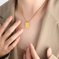 Golden rectangular pendant necklace with letter J on a gold chain worn by model - Letter J Style (P1506-J)