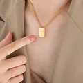 Golden rectangular necklace with embossed letter Y worn with professional attire - Letter Y Style (P1506-Y)