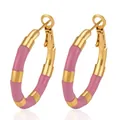 Close-up of pink enamel and gold-toned bamboo-style hoop earrings made of stainless steel - Rose Red